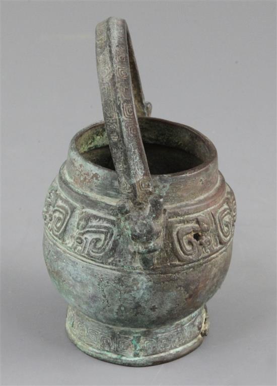 A small Chinese archaic bronze ritual wine vessel, You, Western Zhou dynasty, 10th century B.C., 13cm high, lacking cover